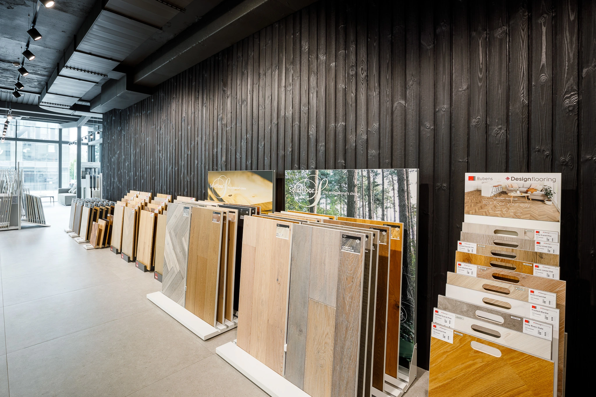KIME Black charred spruce interior lining at Contemporary Interior Showroom in KIME Black Charred Spruce, Lithuania